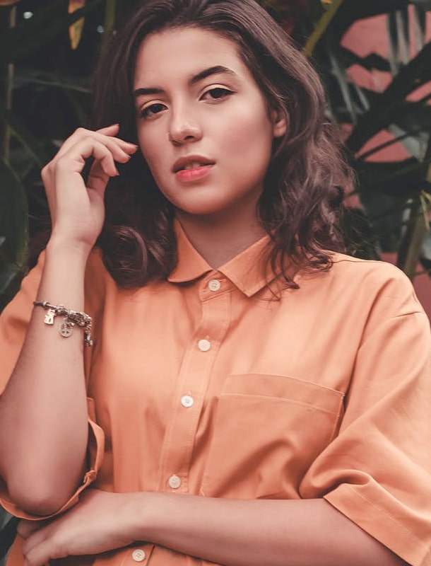 a beautiful woman touching her hair